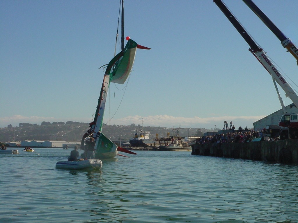 And over she goes – cranes have the weight while the Harbour Works tug pulls the main hull through below to allow the cranes to lower the vessel the right way up. © Martin Balch